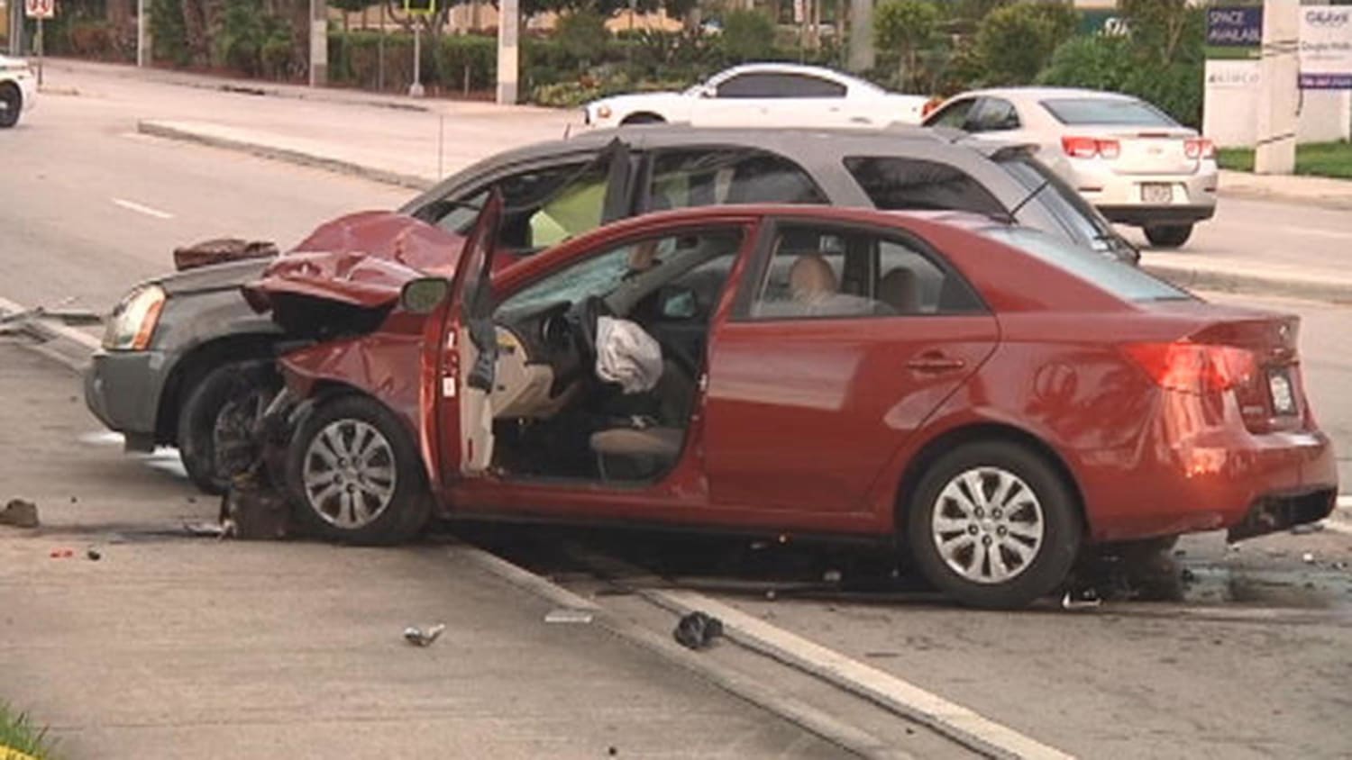 Image: Smashed cars at the scene of a deadly accident.