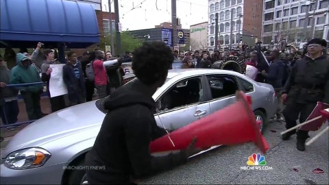 Scattered Resistance Flares in Baltimore as Curfew Takes Effect.