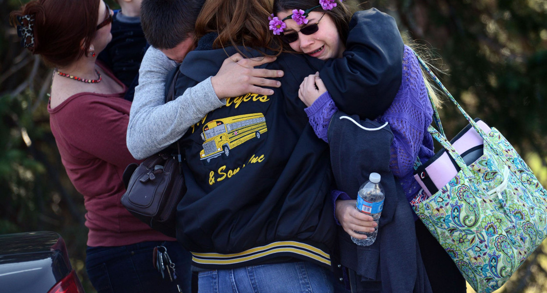 Image:Parents and students embrace along School Road near Franklin Regional High School after more than a dozen students were stabbed by a knife wielding suspect at the school 