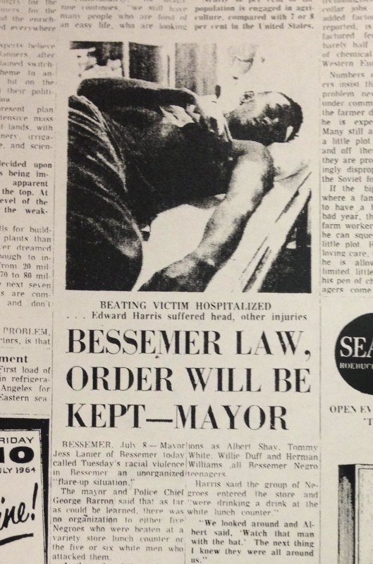 Image: A newspaper clipping from 1964 featured a headline proclaiming, "Bessemer Law, Order will be Kept - Mayor," and a photo of Edward Harris, who was beaten during a sit-in at McLellan's department store.