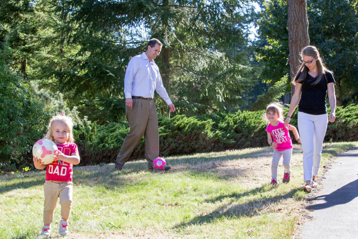 Image: Casey Sullivan, left, plays soccer at home with his daughters Raegan, 2, and Taylor, 4.