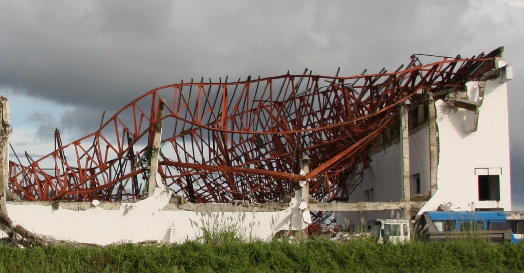 Twisted, steel remains of what were once roofs dot the landscape in Leyte, one year after Typhoon Haiyan.