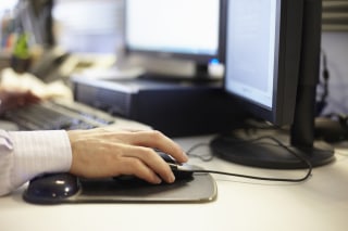 Image: A Man using computer in the office