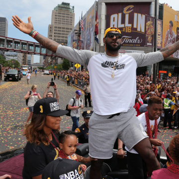 Image: Cleveland Cavaliers Lebron James celebrates with the crowd in downtown Cleveland