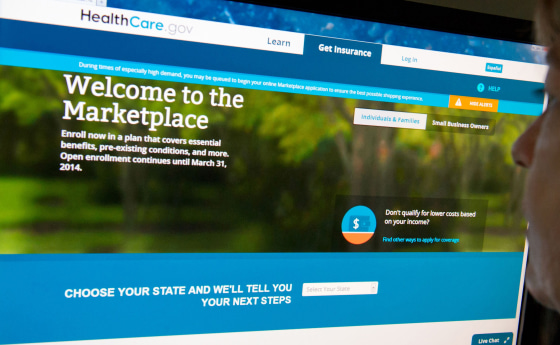 (FILES)This December 2, 2013 file photo shows a woman reading the HealthCare.gov insurance marketplace internet site in Washington, DC.  President Bar...