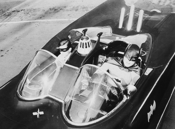 Adam West and Burt Ward as Batman and Robin in the 1960s TV version of the Batmobile.