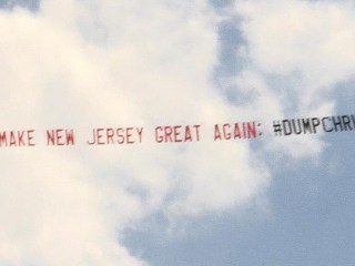 '#DumpChristieTrump' Banner Flies over Christie-Trump Event
