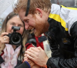 Prince Harry Recognizes, Hugs 97-Year-Old Fan Who Waited in the Rain