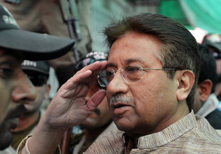 Former Pakistani president Pervez Musharraf salutes as he is escorted by military personnel on his arrival at an anti-terrorism court in Islamabad on April 20, 2013. A Pakistani court indicted former military ruler Pervez Musharraf for treason on charges relating to his 2007 imposition of emergency rule, in a historic first for a country controlled for half its history by the army. Tahira Safdar, one of three judges of a special court convened to hear the case, read out five charges, with the ex-president pleading "not guilty" to each of them. Musharraf declared a state of emergency in November 2007, shortly before the Supreme Court was due to rule on the legality of his re-election as president a month earlier while he was also the army chief. He then arrested and sacked the country's top judges, including the chief justice, who challenged his decision. Musharraf has endured a torrid time since returning to Pakistan in March, 2013, on an ill-fated mission to run in the general election.  AFP PHOTO / AAMIR QURESHIAAMIR QURESHI/AFP/Getty Images