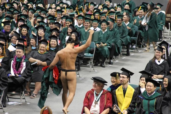 Kalā Kaawa did not plan on stripping off his graduation gown while receiving his diploma, but the last-minute call earned him a standing ovation.