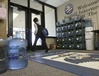 Image: Water bottles line the entrance to Foothill Intermediate School in Loma Rica, Calif.