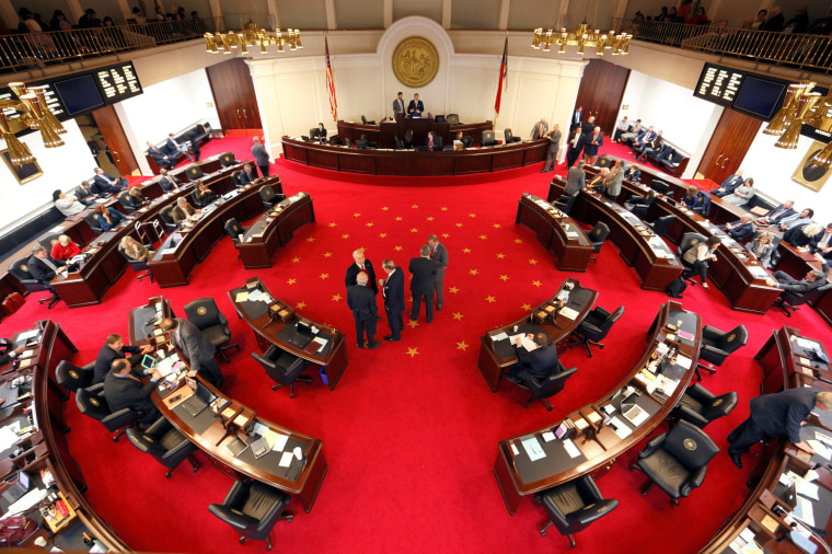 Image: Lawmakers confer during a negotiations on the floor of North Carolina's State Senate chamber as they meet to consider repealing the controversial HB2 law limiting bathroom access for transgender people in Raleigh, North Carolina