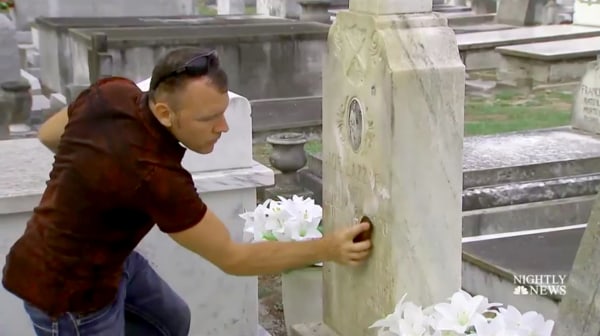 Image: Andrew Lumish, Tampa's "good cemeterian" cleans the headstones of fallen soldiers.