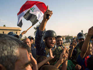 Iraqis Celebrate Bitter Victory Over ISIS in Ruins of Mosul