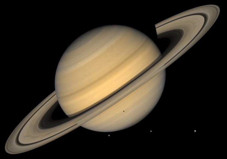 This approximate natural-color image shows Saturn, its rings, and four of its icy satellites. Three satellites (Tethys, Dione, and Rhea) are visible against the darkness of space, and another smaller satellite (Mimas) is visible against Saturn's cloud tops very near the left horizon and just below the rings. The dark shadows of Mimas and Tethys are also visible on Saturn's cloud tops, and the shadow of Saturn is seen across part of the rings. Saturn, second in size only to Jupiter in our Solar System, is 120,660 km (75,000 mi) in diameter at its equator (the ring plane) but, because of its rapid spin, Saturn is 10% smaller measured through its poles. Saturn's rings are composed mostly of ice particles ranging from microscopic dust to boulders in size. These particles orbit Saturn in a vast disk that is a mere 100 meters (330 feet) or so thick. The rings' thinness contrasts with their huge diameter--for instance 272,400 km (169,000 mi) for the outer part of the bright A ring, the outermost ring visible here. The pronounced concentric gap in the rings, the Cassini Division (named after its discoverer), is a 3500-km wide region (2200 mi, almost the width of the United States) that is much less populated with ring particles than the brighter B and A rings to either side of the gap. The rings also show some enigmatic radial structure ('spokes'), particularly at left. This image was synthesized from images taken in Voyager's blue and violet filters and was processed to recreate an approximately natural color and contrast. http://photojournal.jpl.nasa.gov/catalog/PIA00400