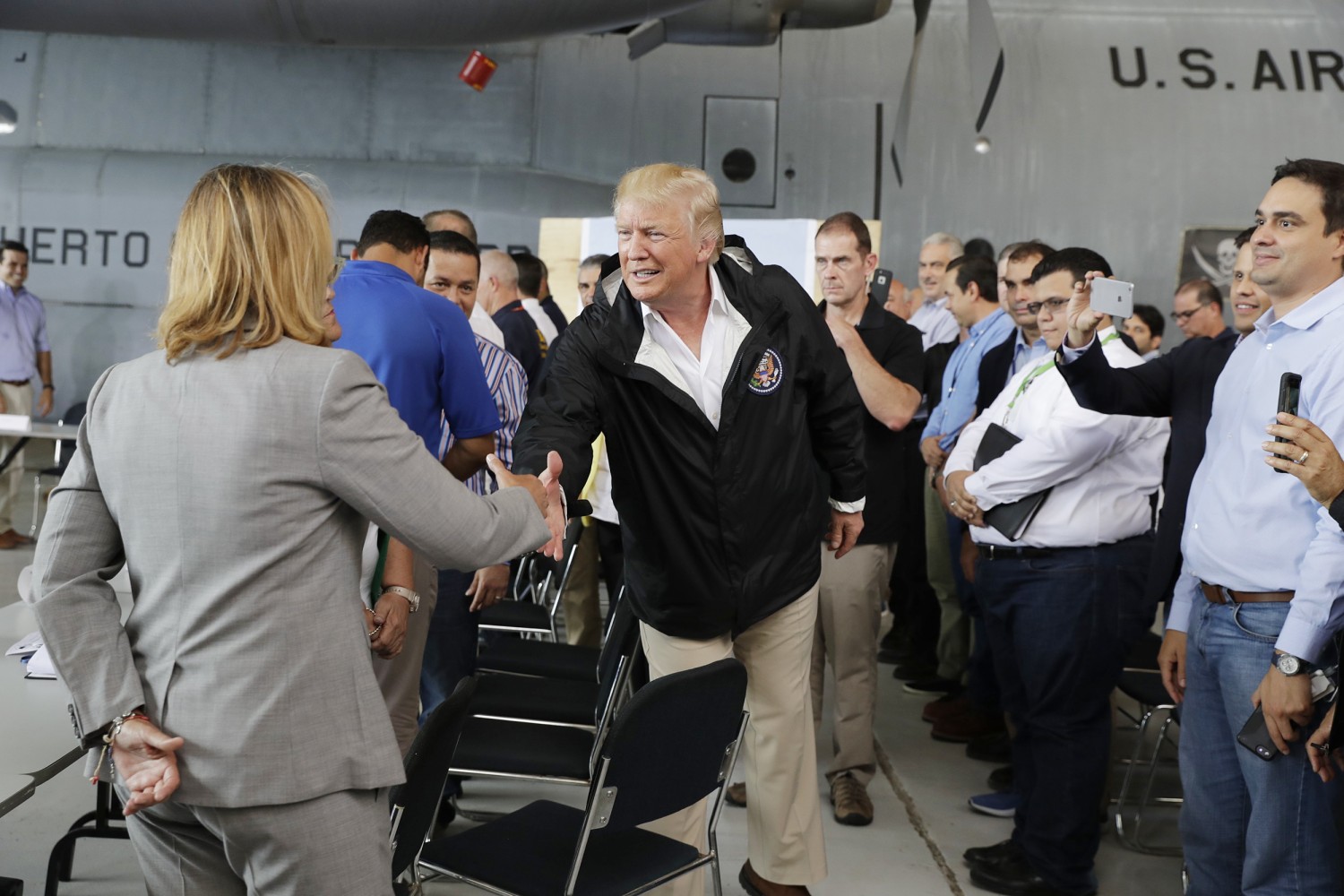 Image result for photos of trump in disaster areas of puerto rico florida and texas