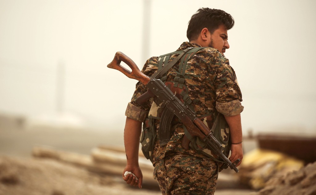 Image: A member of the Kurdish People's Protection Units in Raqqa, Syria