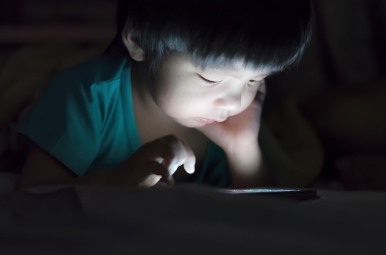 Image result for child on tablet in bed