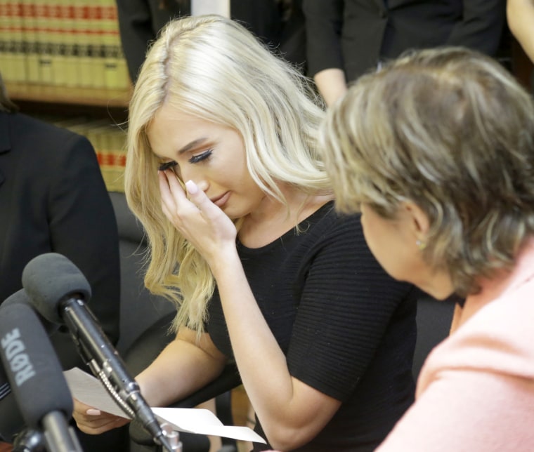   Image: Hannah Turnbow, former Houston Texans cheerleader, dries tears as she sits next to attorney Gloria Allred during a press conference on June 1, 2018, in Humble, Texas, announcing a lawsuit in name of five former NFL cheerleaders. 