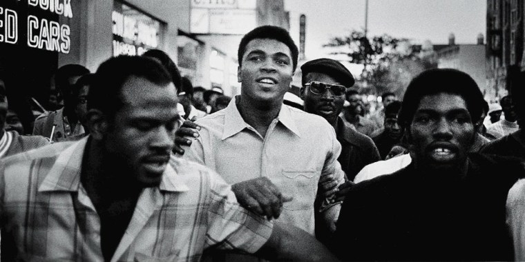 Image: American heavyweight boxing champion Muhammad Ali walks through the streets with members of the Black Panther Party, New York, Sept. 1970.