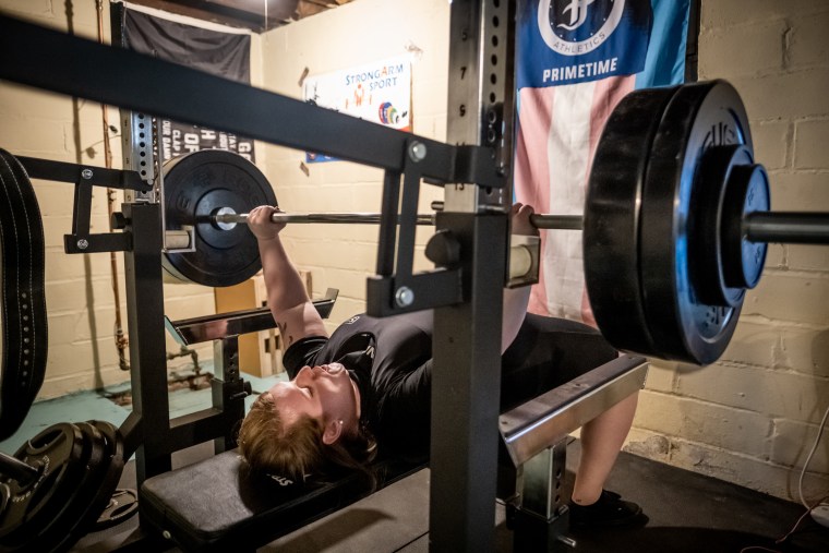 Photograph of JayCee Cooper lifting.