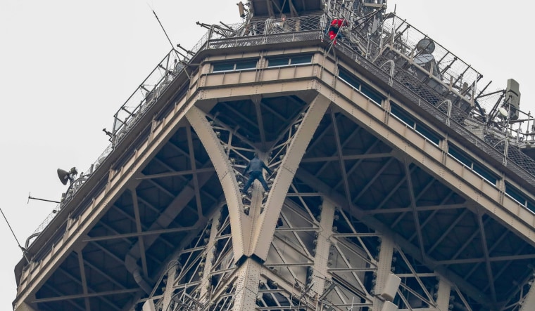 Police swarm Eiffel Tower as man climbs the Paris landmark