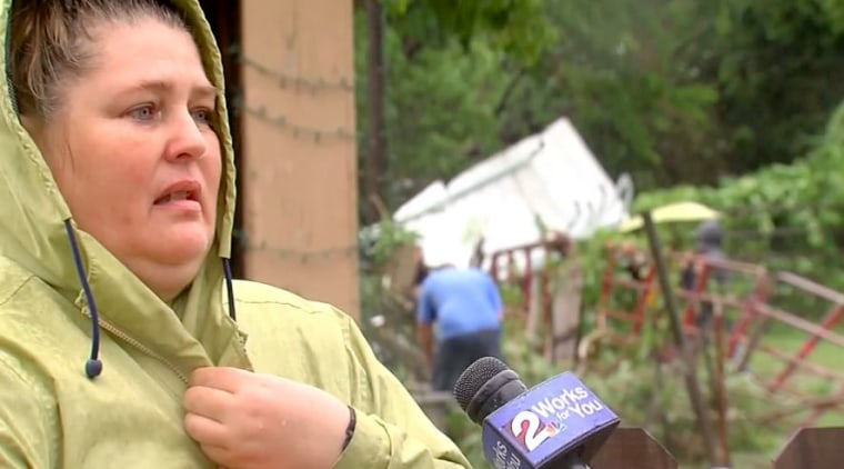 Image: Lisa Watson speaks to a reporter after surviving a storm in Tulsa, Oklahoma.