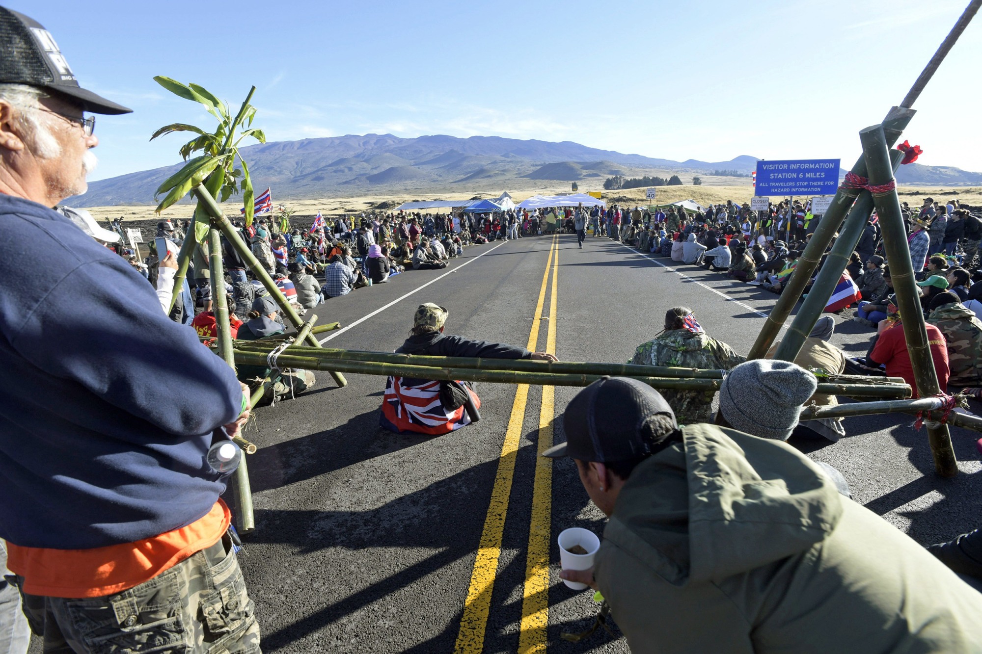 Mauna Kea Protesters sitting on a road on the Big Island of Hawaii