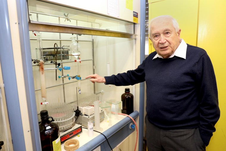 Raphael Mechoulam explaining steps of the process at his Hebrew University lab in Israel.