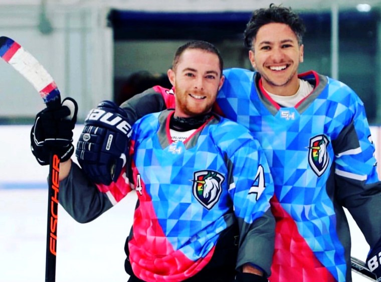 Image: Hutch Hutchinson and Shane Diamond, players on Team Trans for the Boston Pride Hockey League.