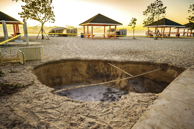 Image: A sinkhole appeared in West Bay, Grand Cayman, after an earthquake struck in the Caribbean Sea on Jan. 28, 2020.