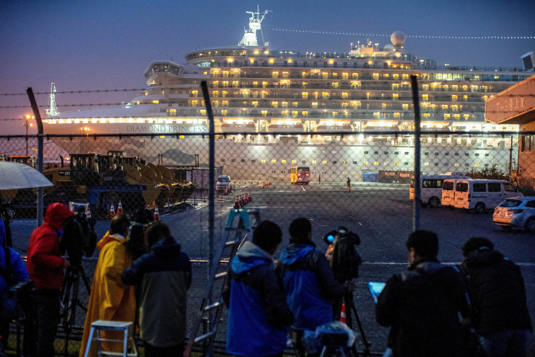 Image: FILE PHOTO : A bus arrives near the cruise ship Diamond Princess, where dozens of passengers were tested positive for coronavirus, at Daikoku Pier Cruise Terminal in Yokohama