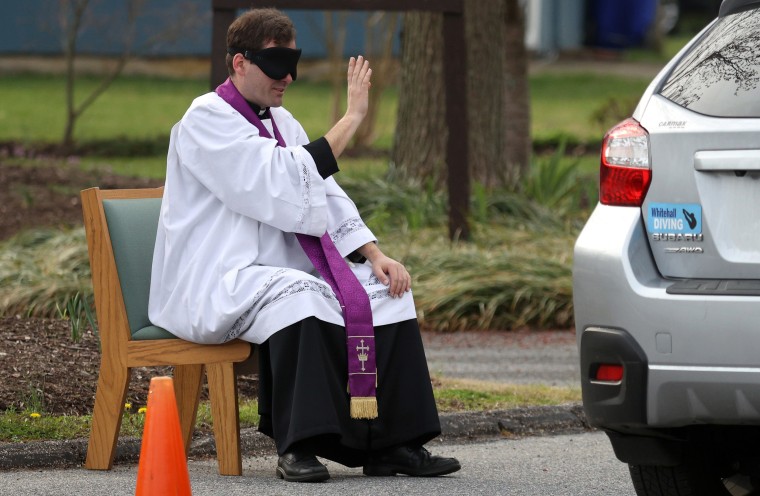 Image: Priest In Maryland Offers Drive Thru Confession As Communities Across Country Encouraged To Practice Social Distancing To Stop Spread Of Coronavirus