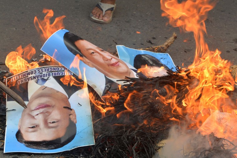 Image: Burning posters of Chinese President Xi Jinping