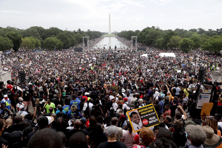 People participate in the March on Washington, on Aug. 28, 2020, at the Lincoln Memorial.