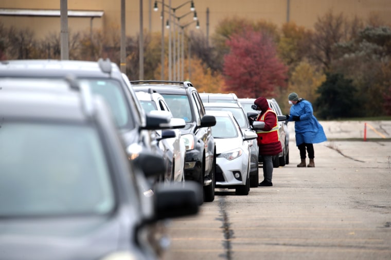 Image: Cars Line Up For Covid Testing In Milwaukee, As Cases Spike In The State
