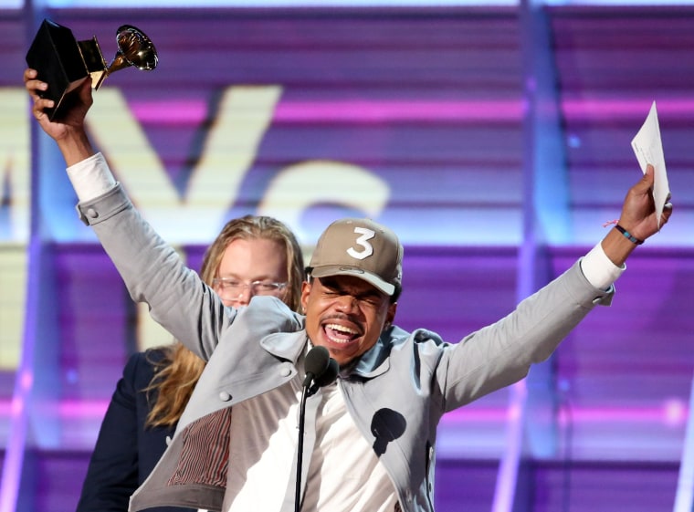 Image: Chance the Rapper celebrates as he accepts the Grammy for Best Rap Album for "Coloring Book" at the 59th Annual Grammy Awards in Los Angeles
