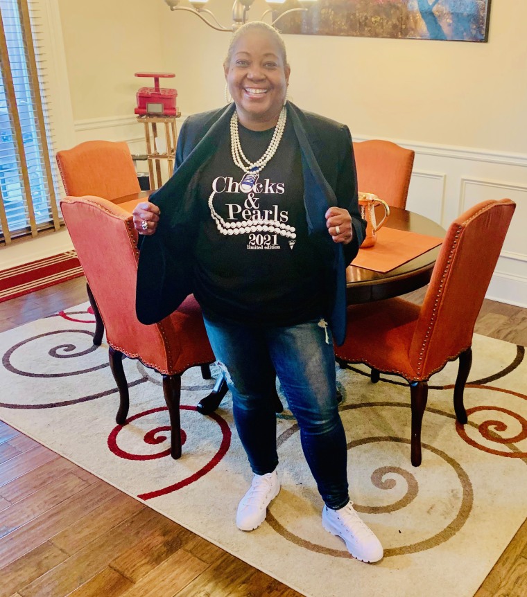 Felicia Cheek gets ready for Inauguration Day 2021 by wearing a "Chucks and Pearls" T-shirt, sneakers and a pearl necklace.