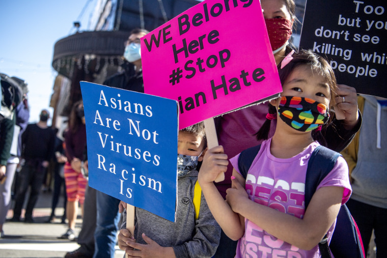 Image: Betty Wu, center, and her children, Timmy, 3, and Kayley, 5, at a "Stop Asian Hate" rally Saturday in Pittsburgh. 