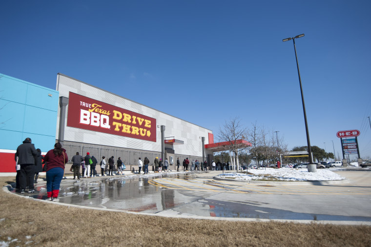 February 19, 2021: People wait in line to enter H-E-B supermarket in Austin. Austin, Texas.