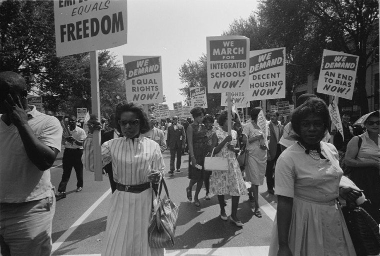 A procession of protesters carrying signs for equal rights, integrated schools, decent housing, and an end to bias in Washington, D.C., on Aug. 28, 1963.