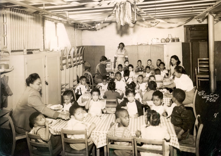 Children sit at a segregated day care center in Evanston, Il., in 1940.