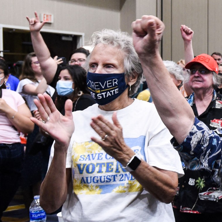 Abortion rights supporters cheer as the proposed constitutional amendment that would severely restrict abortion access fails at a primary night watch party in Overland Park, Kansas, on Aug. 2, 2022.
