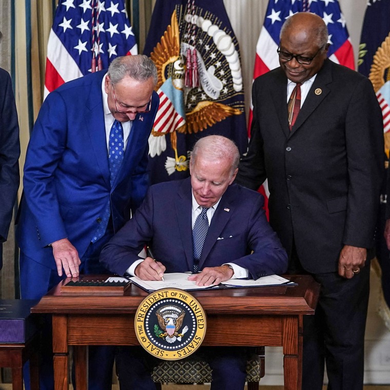 Image: President Joe Biden signs the Inflation Reduction Act of 2022 into law during a ceremony in the State Dining Room of the White House on Aug. 16, 2022.