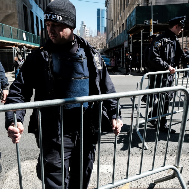 Police set up barricades outside of a courthouse in New York on March 21, 2023, ahead of a potential indictment of former President Donald Trump.