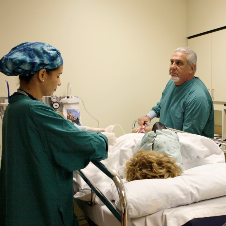 Dr. Pedro Jose Greer, right, prepares to do a colonoscopy at Mercy Hospital