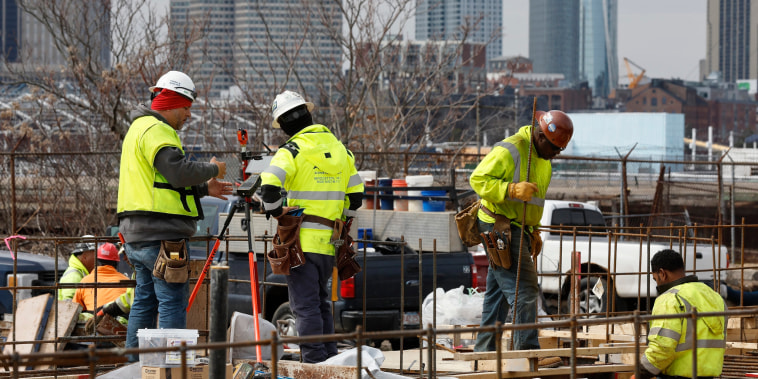 People work at a construction site in Boston